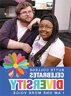 Two students pose with diversity days sign